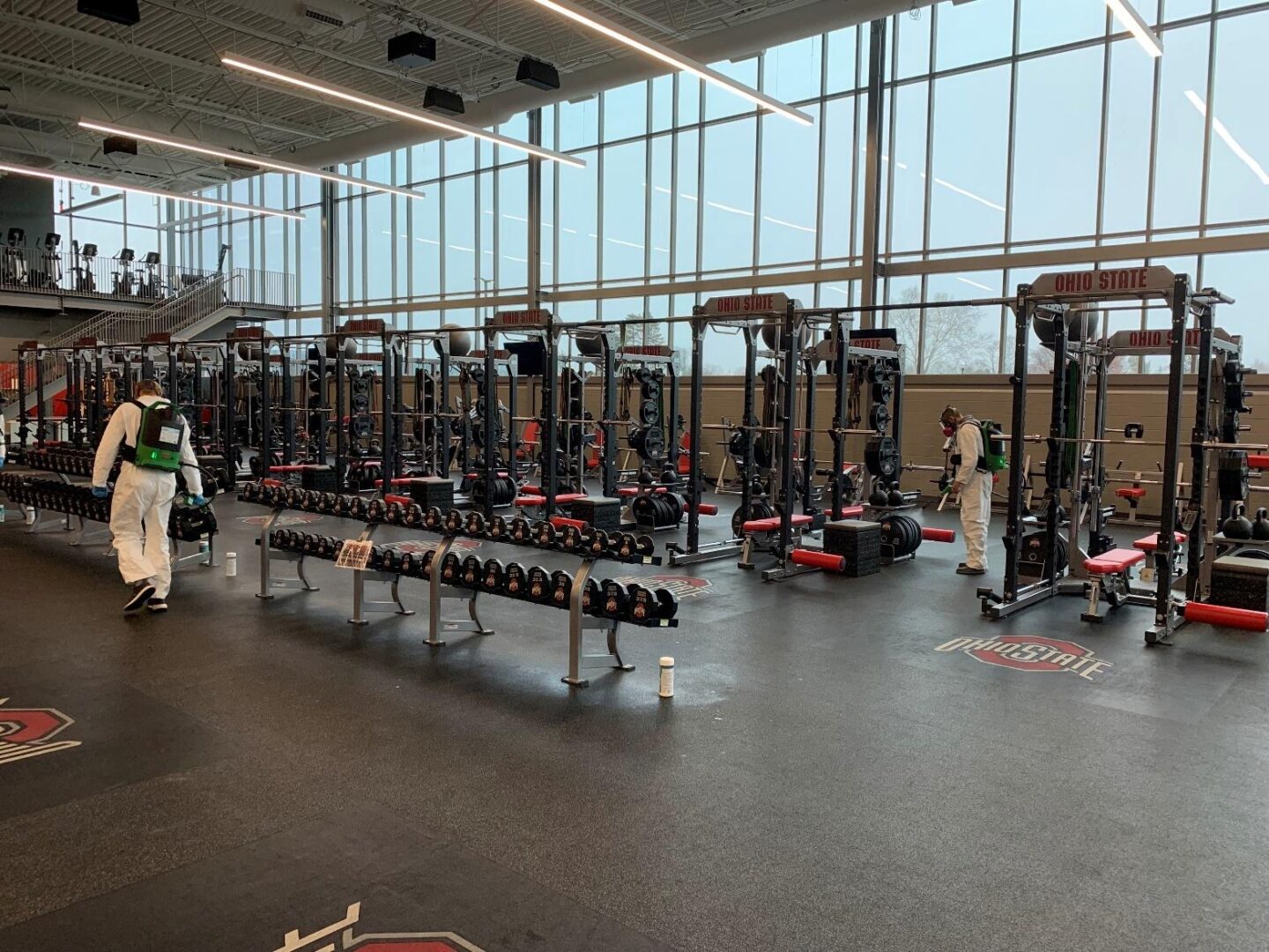 A gym with a lot of equipment in it.
