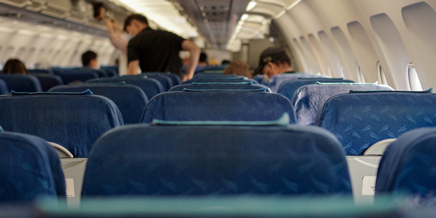 The empty seats of an airplane.