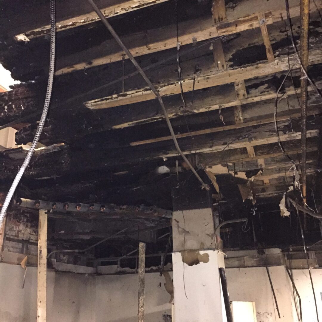 The damaged ceiling of a building that has been affected by fire may require odor control.